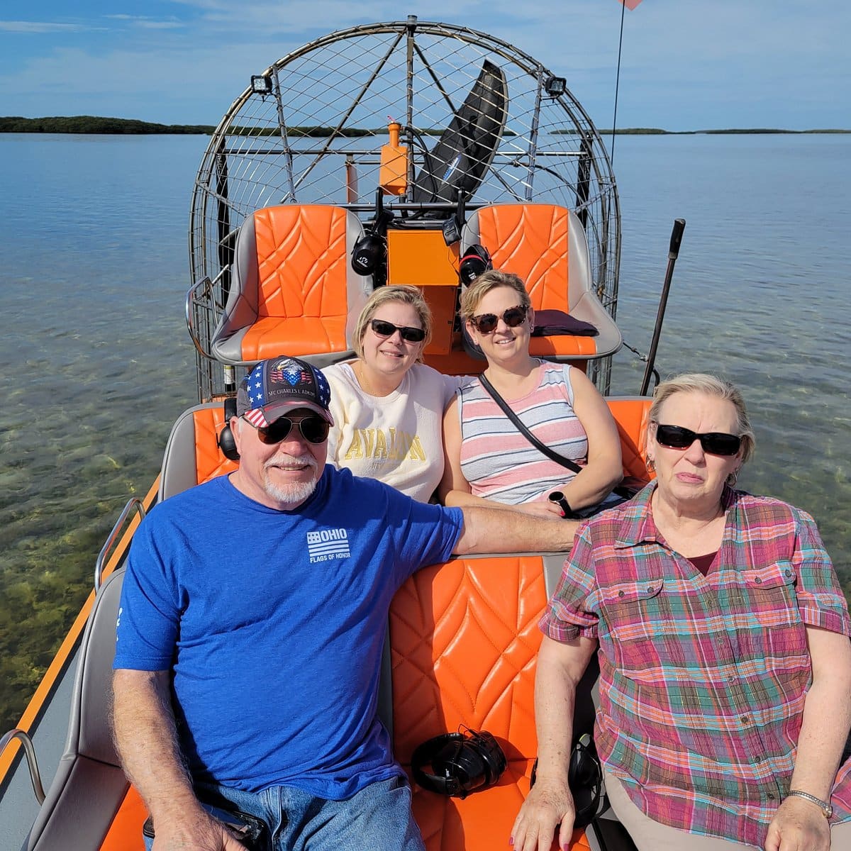 Guests sit in orange airboat seats on the water in Homosassa.